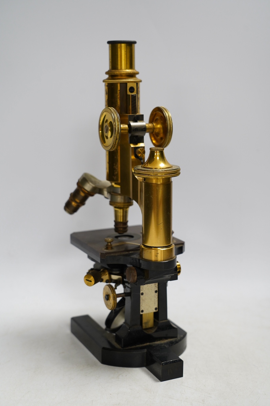 A Carl Zeiss microscope, detailed by Baker 244 High Holborn, London, in a fitted mahogany cased with alternative lenses, etc., case 38cm. Condition - fair to good